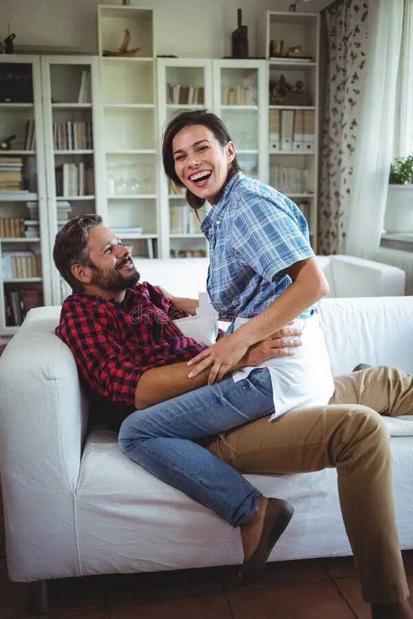 Sitting in lap. Woman lap sitting man. Sitting on a man's lap. Woman sitting on lap.