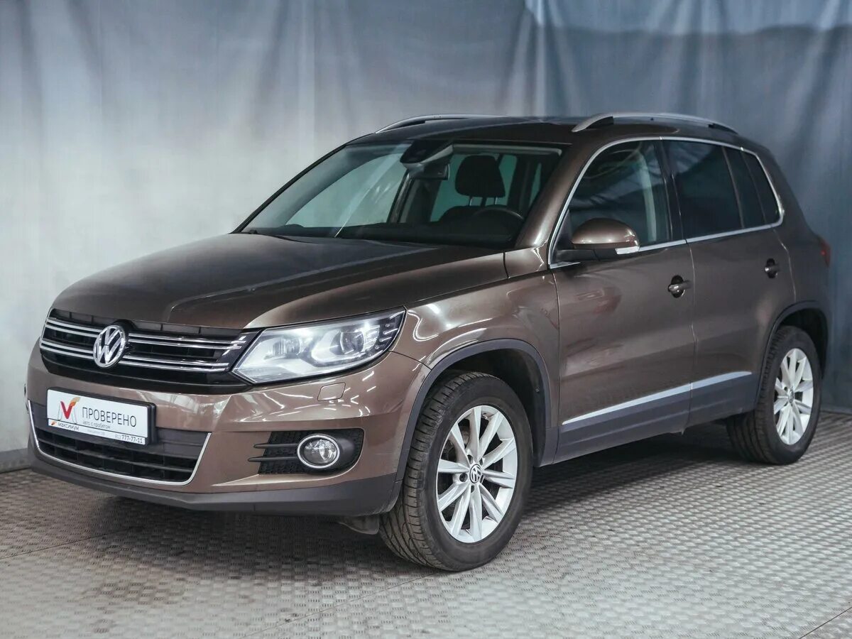 Volkswagen tiguan 2014. Фольксваген Тигуан 2014. Volkswagen Тигуан 2014. Фольксваген Тигуан 2014г. Volkswagen Tiguan первый Рестайлинг-2014.