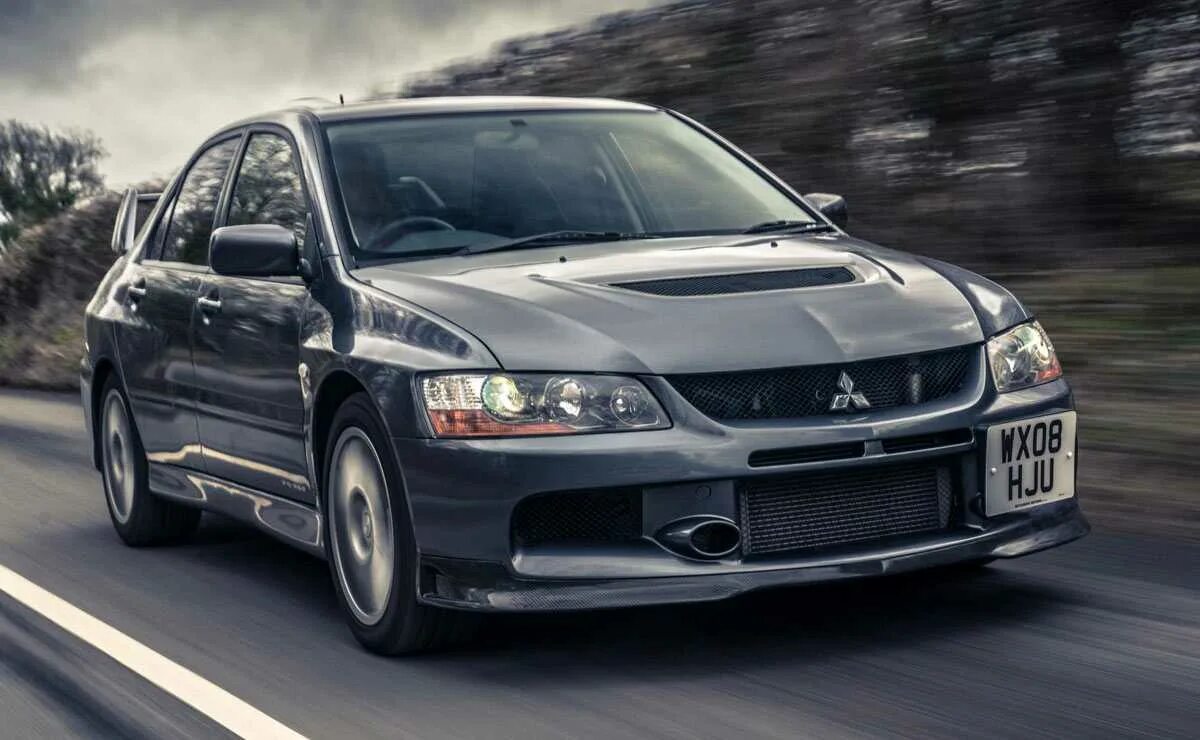 Mitsubishi life. Митсубиси Лансер Эволюшн. Митсубиси Лансер Эволюшн 9. Mitsubishi Lancer EVO 3 Black. Митсубиси Лансер Эволюшн 7.