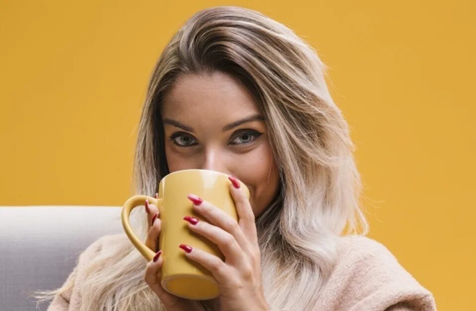 Drinking coffee she