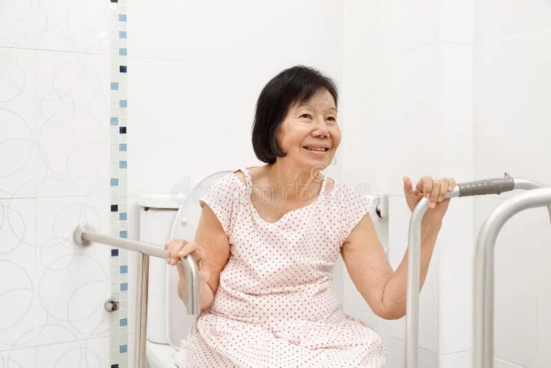 Elderly Woman Holding on Handrail in Toilet. Stock Image - Image of health, grip