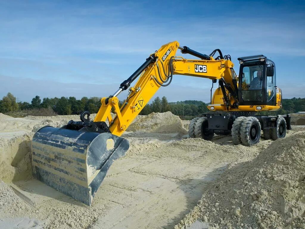 JCB js145w. Экскаватор JCB w145. Колесный экскаватор JCB js 145w. JCB 140 колесный экскаватор. Аренда колесного полноповоротного экскаватора