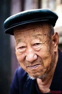 Portrait of old chinese man in Pingyao, China Royalty Free Image.