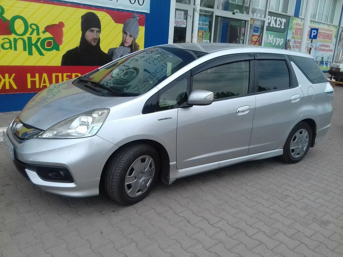 Honda Fit Shuttle 2014. Хонда фит Шатл. Хонда фит шаттл гибрид 2013 год. Хонда фит Шатл 2014 год гибрид.