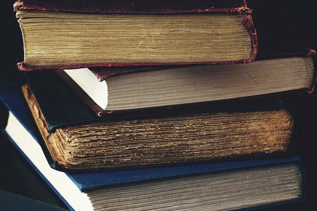 Anatomy and physiology books on an old wooden table free image download