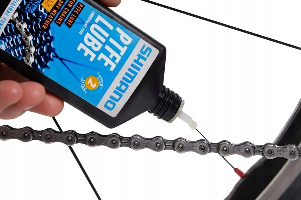 Как называется цепь на велосипеде. Shimano PTFE Lube. Смазка для цепи велосипеда Shimano. Смазка для цепи шимано. Смазка велоцепи шимано.