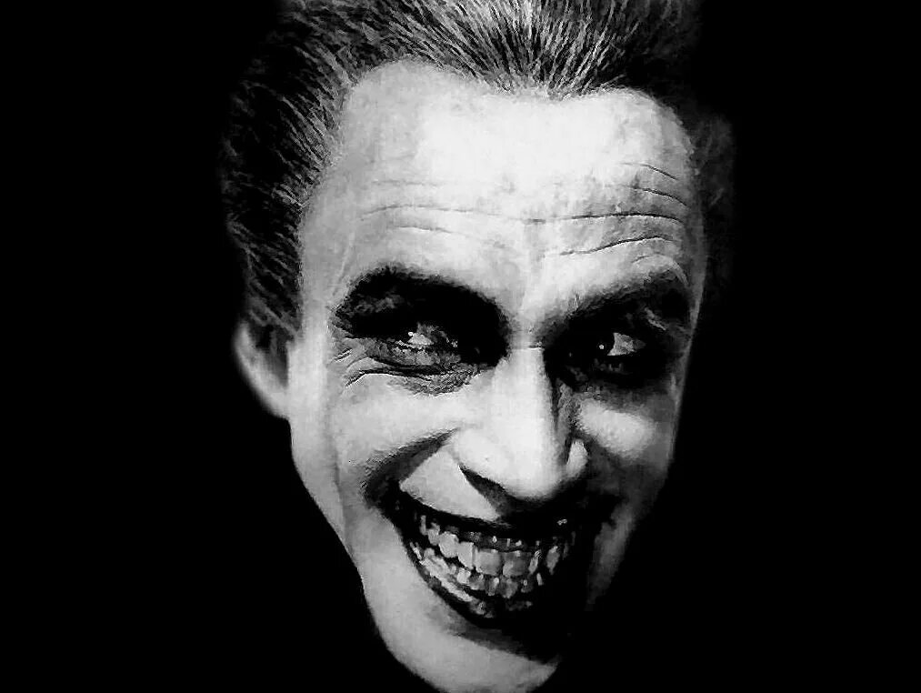 Страшное белое лицо с улыбкой. Улыбающуюся человек хоррор. Джек николсон джокер. Страшные рисунки карандашом. Конрад фейдт человек который смеется.