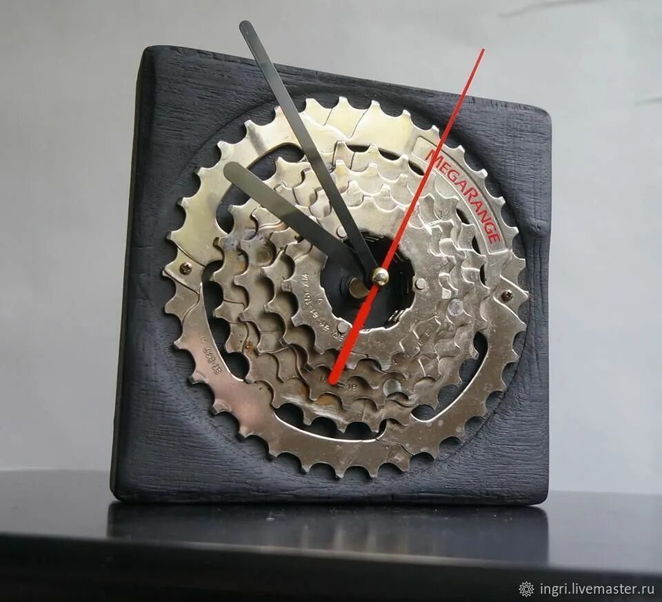 Homemade clock from scrap wood, bike parts, and clock parts from a $5 clock from