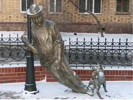 Памятник мужчина с собакой