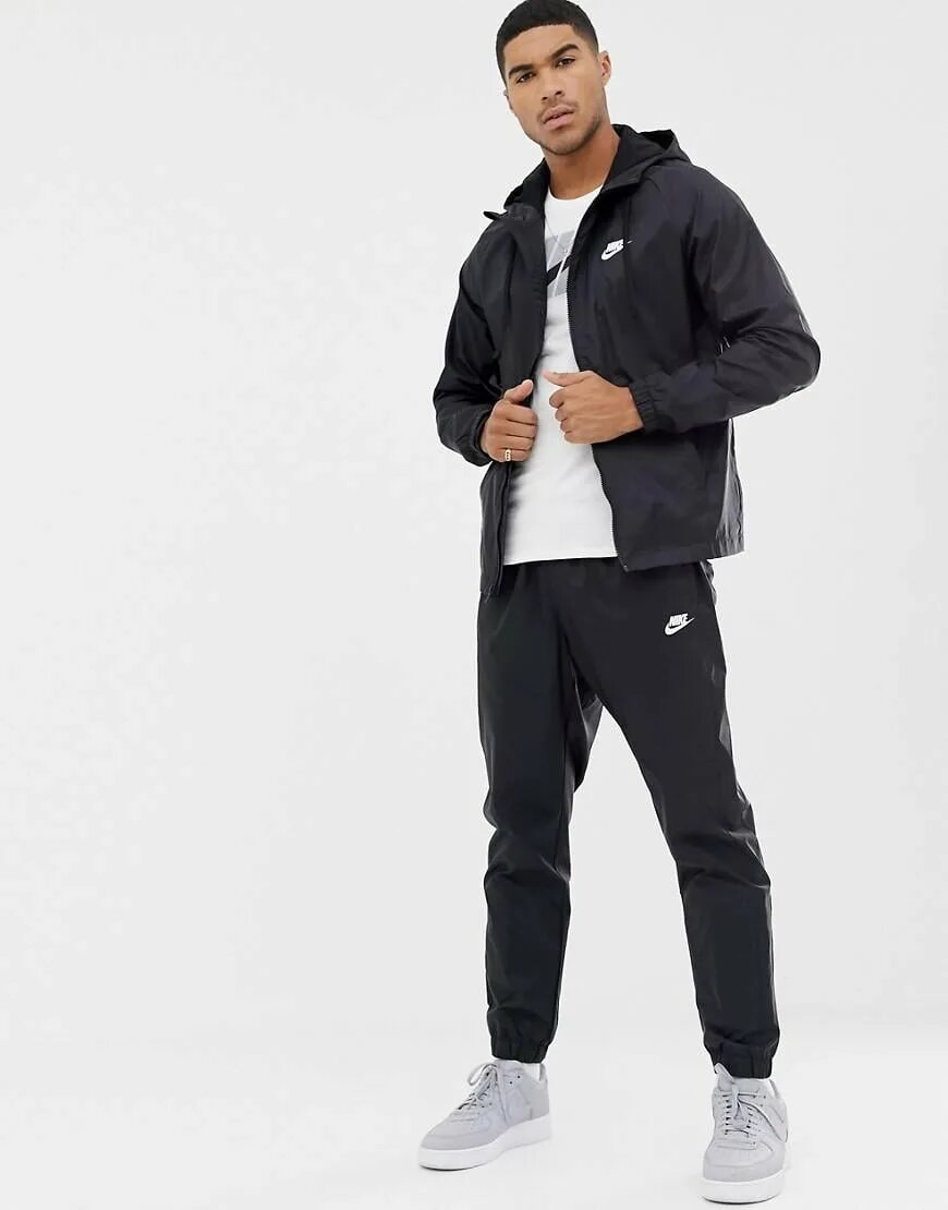 Найк для мужчин. Nike (найк) мужской спортивный костюм 928119-010. Nike Tracksuit костюм мужской. Костюм Nike Sportswear Tracksuit. Nike спортивный костюм мужской 2020 Swoosh.