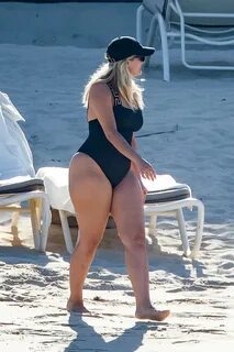 bebe rexha shows off her curves in a black swimsuit while enjoying a beach ...