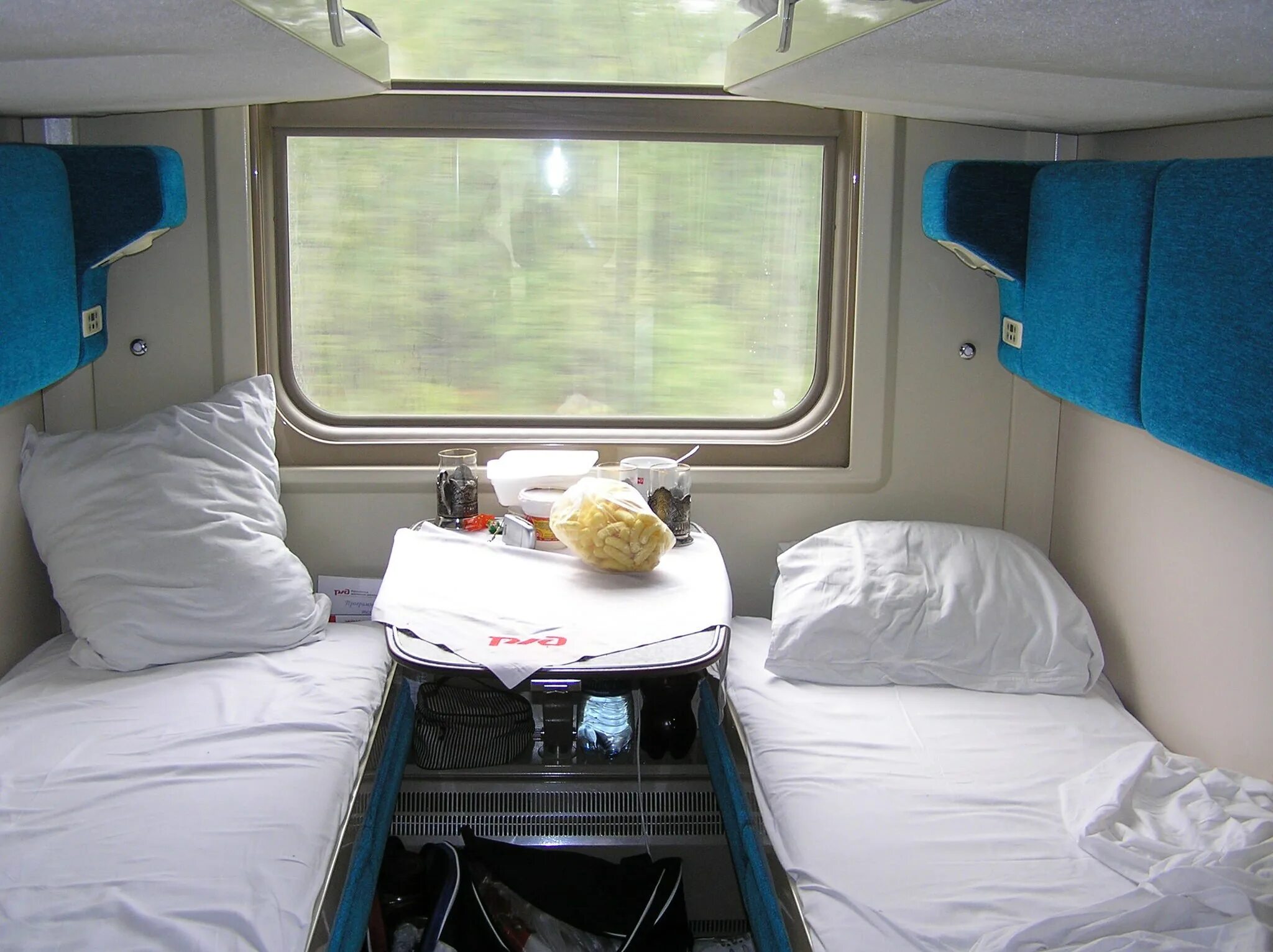 Вагон св ржд 1у. Купе ржд 001м. Св ржд фирменный 001. Вагон св ржд двухместный. Люкс в северной пальмире.