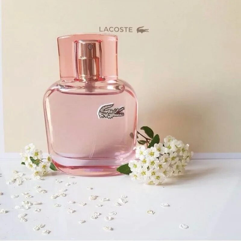 Eau de lacoste sparkling. Лакост Спарклинг. Духи лакост 12 sparkling. Лакосте 12.12 женские pour elle sparkling. Розовый лакост Спарклинг.