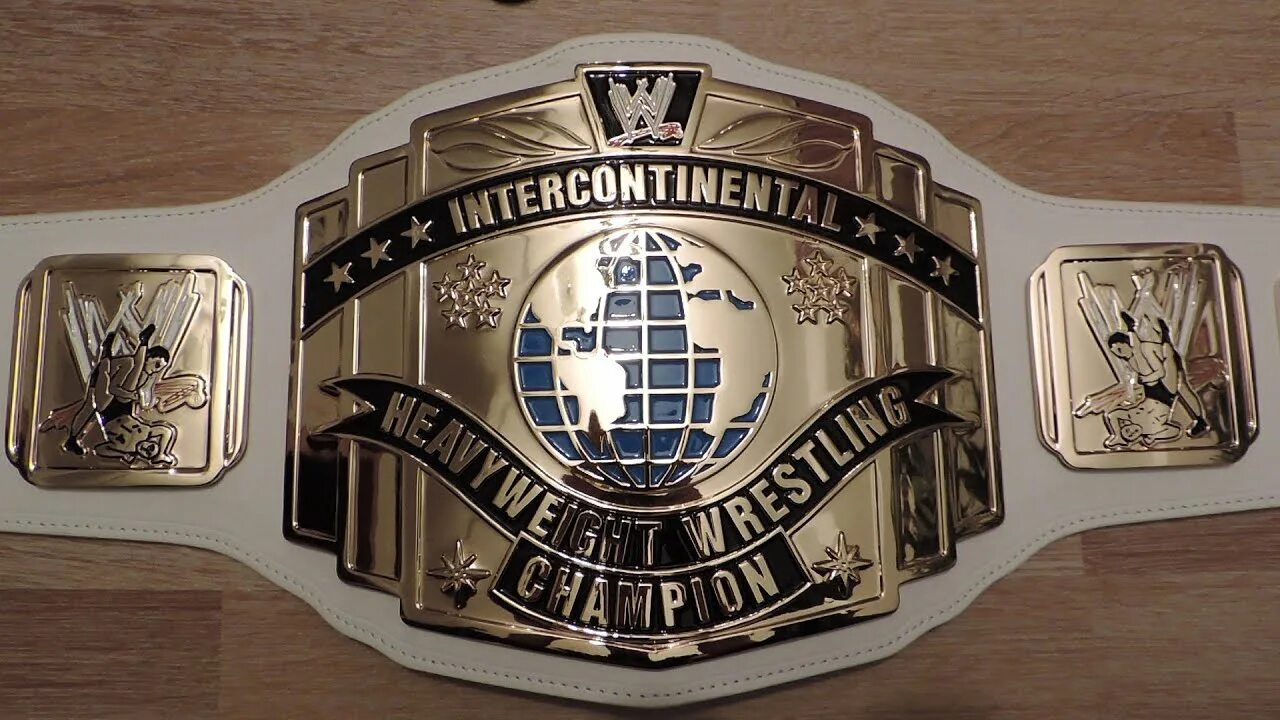 Ик титул. Интерконтинентальный титул wwe. интерконтинентальный чемпион wwe. титулы wwe межконтинентальный. wwe пояс интерконтинентального чемпиона.