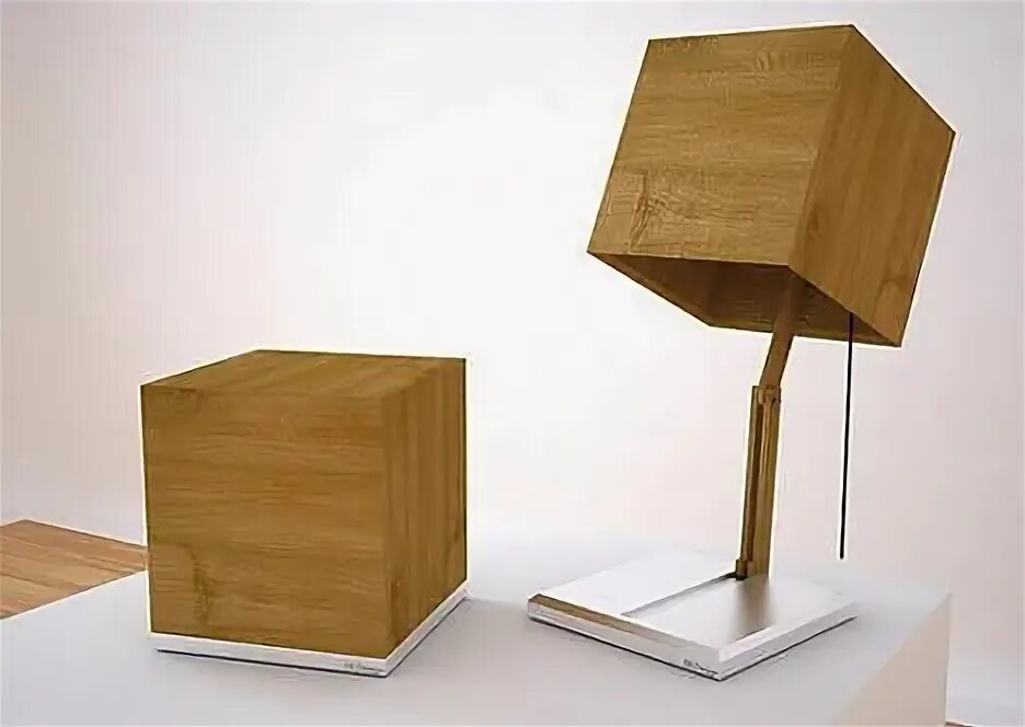 The lamp is on the desk