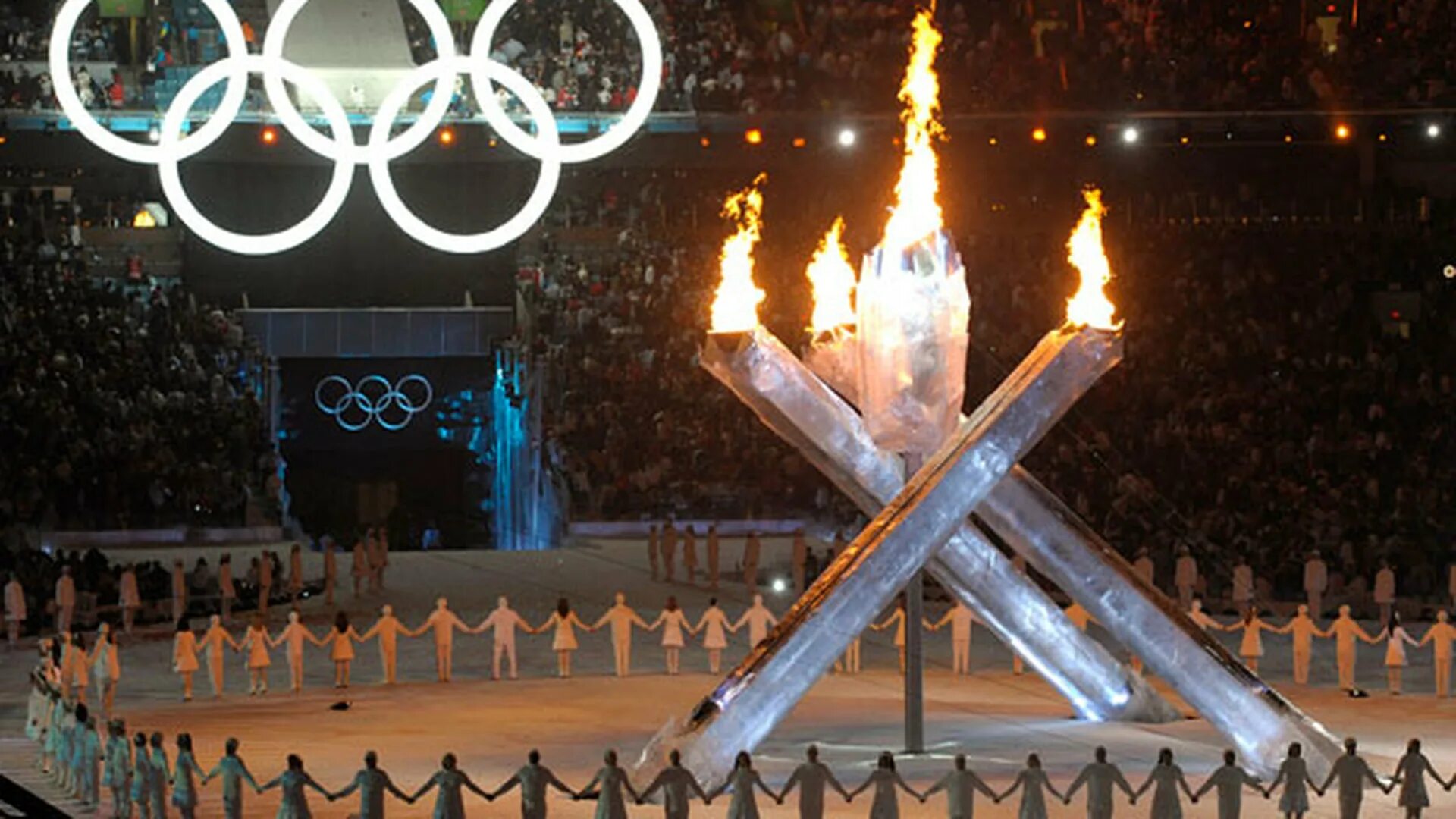 олимпийские игры в сочи 2014 олимпийский факел. зажжение олимпийского огня в сочи. зимние олимпийские игры в солт лейк сити 2002. олимпийский огонь в сочи 2014 фото. вечный огонь сочи олимпийский.