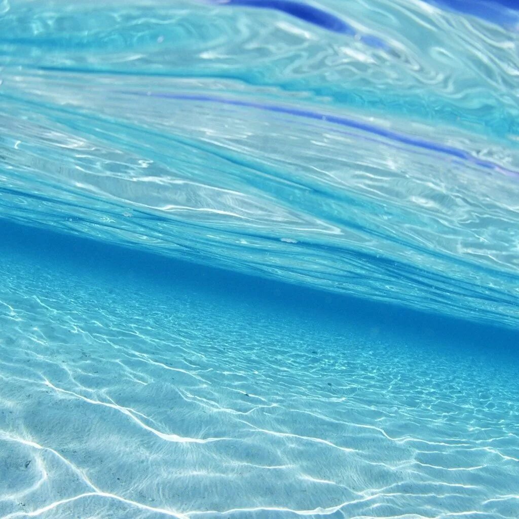 Океан голубая вода. Прозрачное море. Поверхность океана. Морской фон. Море вода.