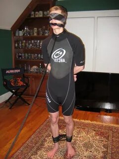 More wetsuit bondage.