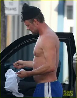 Josh Duhamel takes off his shirt to change into a fresh one after his worko...
