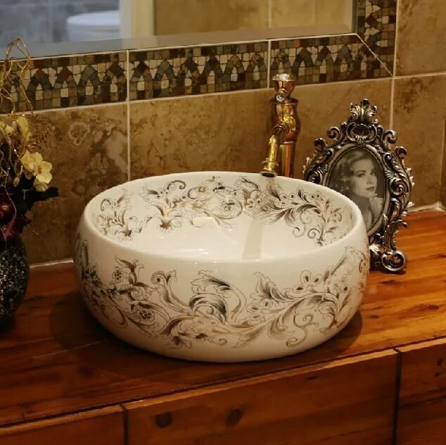 каменная раковина для ванной. керамическая мойка для ванной. керамическая раковина круглая. умывальник в ванную круглый керамический. раковина чаша melana qc3.