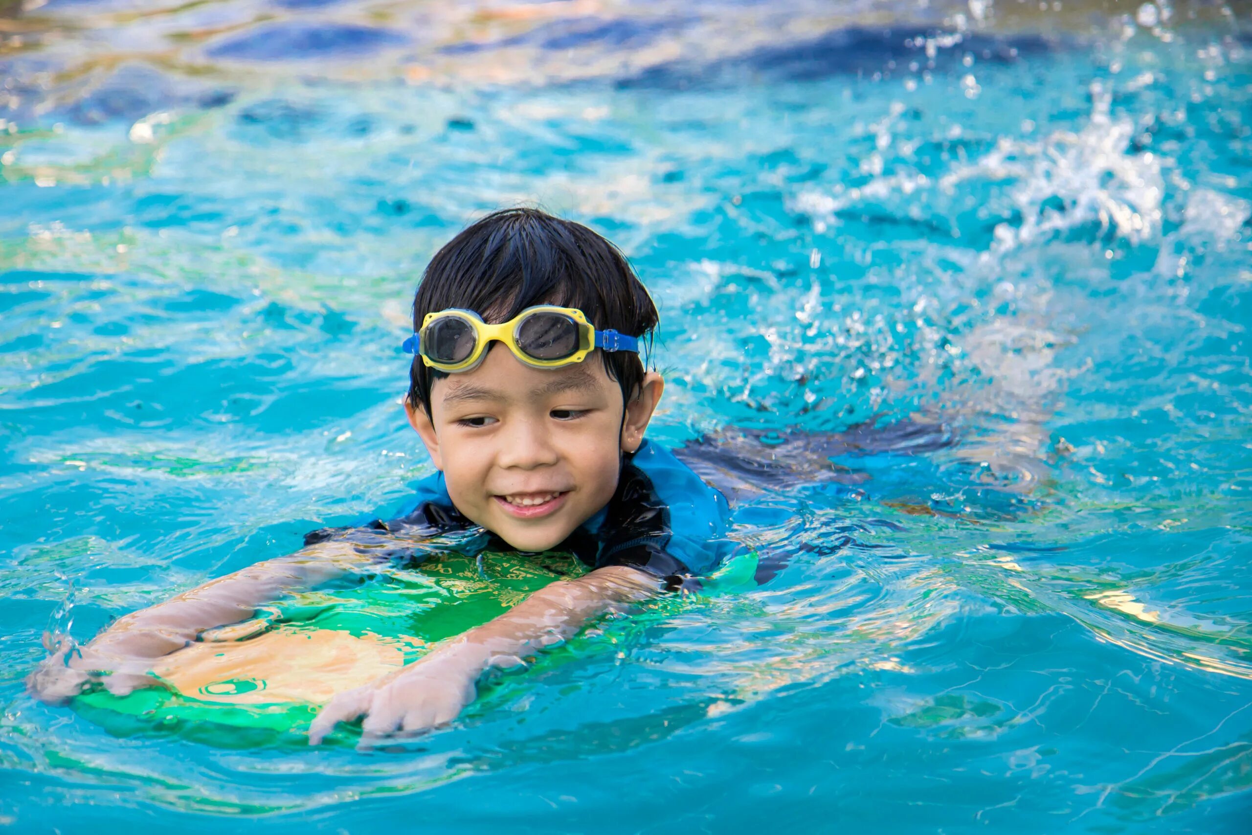 He swims in the pool