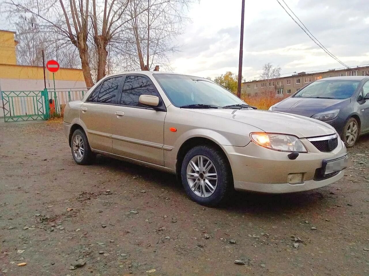 2002 г 114. Мазда 323 2002. Mazda 323 2002 года. Модель Мазда 323 2002. Mazda 2002 года.