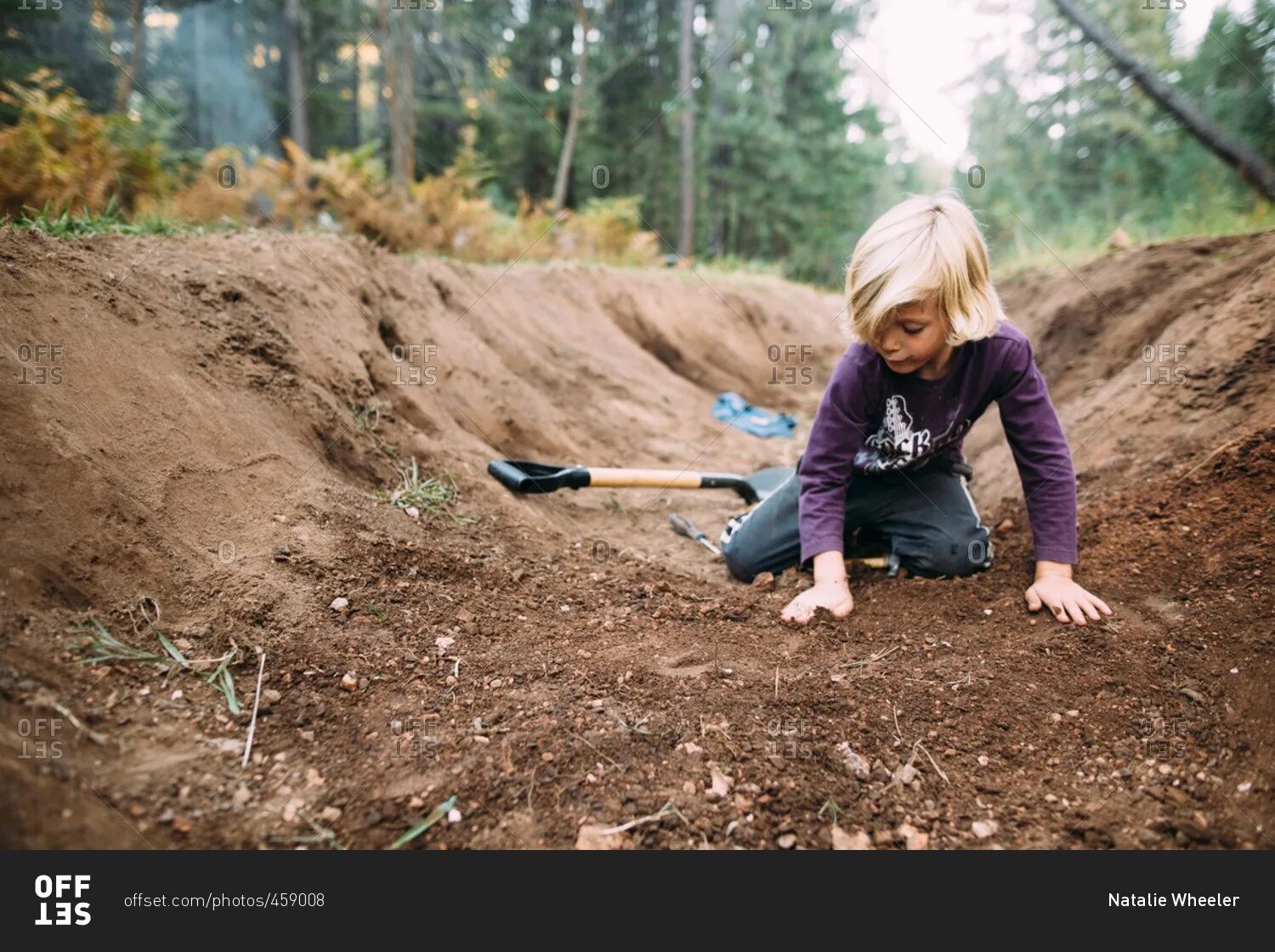 Digging на русском. A boy is digging the ground. He is digging the ground. Shoving Dirt with a Shovel.. Digging the ground with a Needle picture.