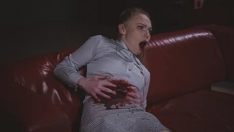 Kelly is reading at home when her partner returns. 