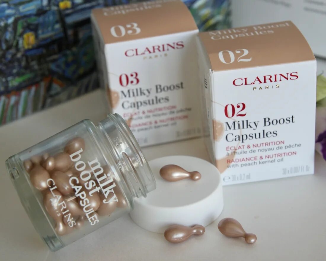 Milky boost capsules. Clarins milky boost cream свотчи. Clarins milky boost. Баночка с капсулами. Clarins флюид для лица.