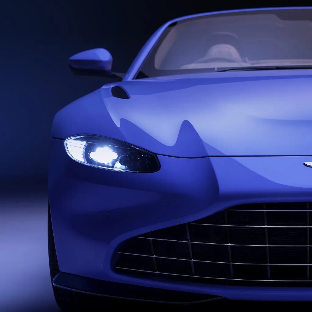 Маленькая синяя машина. Aston Martin Roadster. Aston Martin v8 Vantage 2020. Синий цвет автомобиля. Красивые машины на синем фоне.
