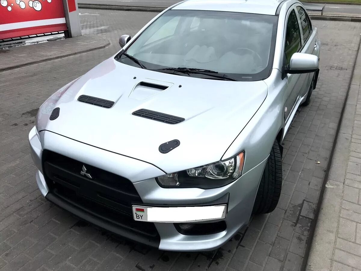 Митсубиси купить б лансер. Lancer EVO 10. Лансер 10 Эволюшн. Митсубиси революшен 10 Лансер. Мицубиси Лансер 10 революшен.