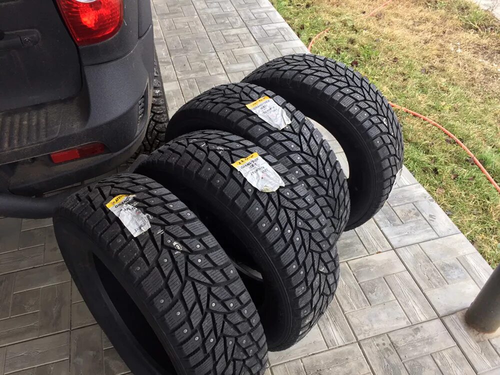 Купить новые шины 215 65 16. Dunlop Grandtrek Ice 02. Зимняя резина на Шевроле Нива 205/70 r15. Данлоп грандтрек айс 02 215/65 r16. Шины 205/70 r16 зимние шипованные ниву.