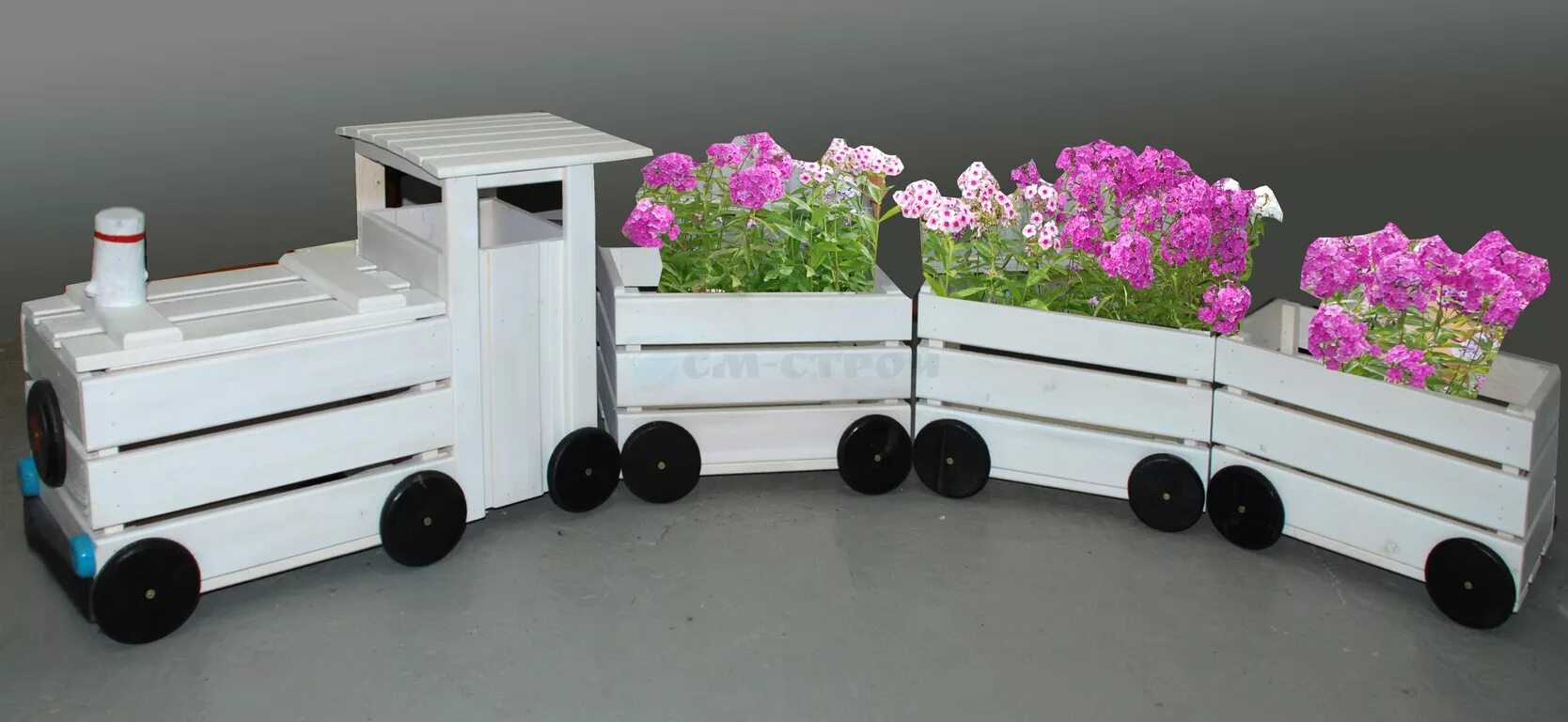 клумба паровозик из ромашково. цветочная клумба паровозик. паровозик цветник. клумба паровозик. клумба паровозик.