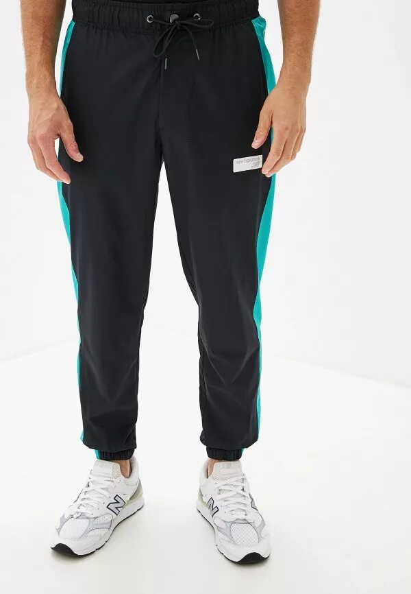 Штаны new balance. Брюки спортивные NB Athletics Windbreaker Pant. Брюки New Balance mp91507. Нью бэланс штаны. Штаны спортивные Нью баланс.