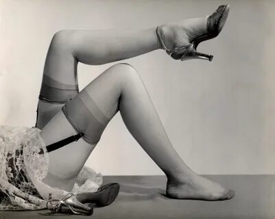 Model wearing nylon stockings and garters, circa 1950s. 