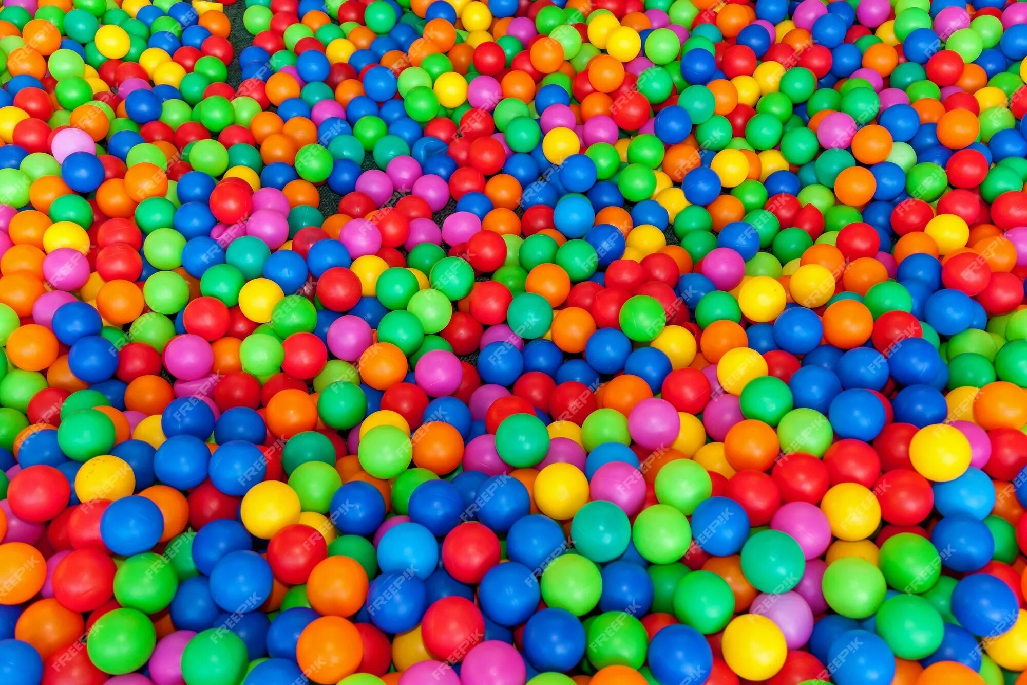 Бассейн с цветными шариками в темноте. Мячики цветные фон. Pool Ball background. In the balls. Lots of colours