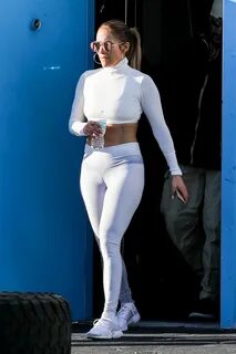 jennifer lopez rocks white crop top and niyama sol leggings as she