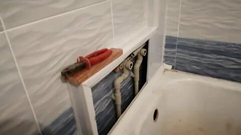 Как закрыть трубы под ванной