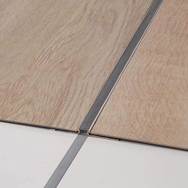 переход ламината. стык между плиткой и ламинатом. гибкий профиль cezar flex line (40мм * 3м). переход ламината. плитка с ламинатом в коридоре.