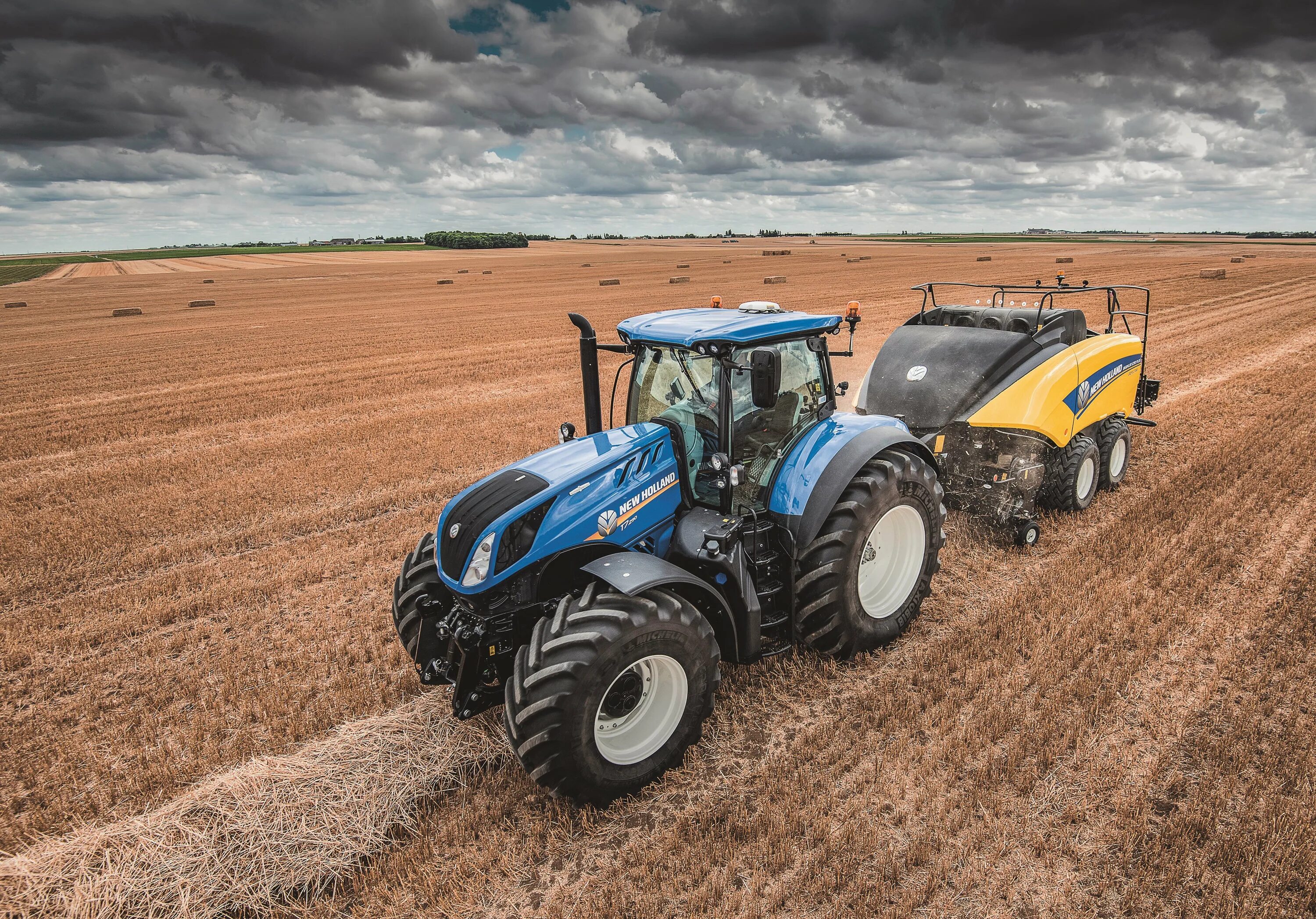 Трактор 8 апреля. Трактор нью холланд. new holland t10. трактор new holland t9040. нью холланд трактор 8 колесный.