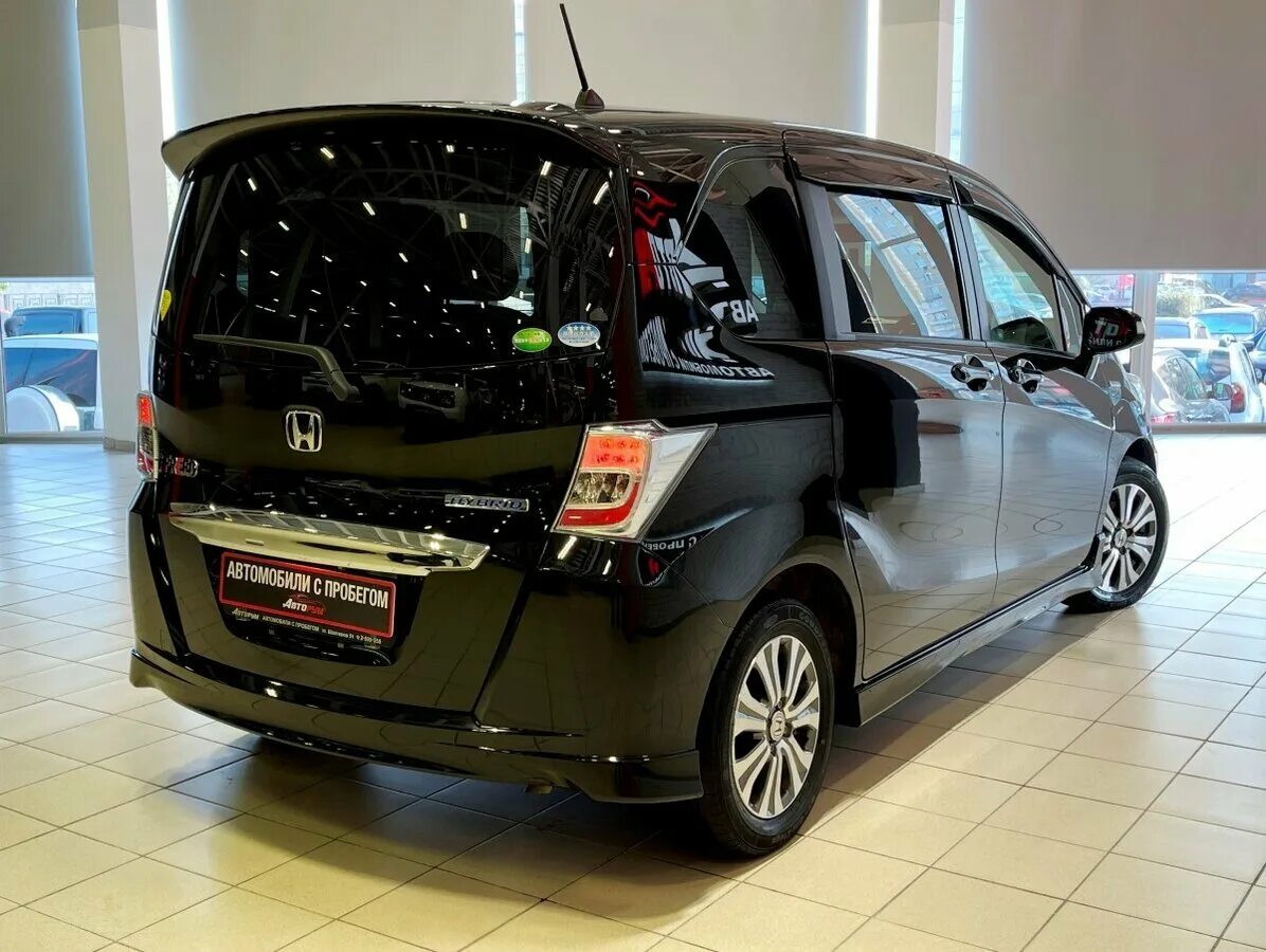 Honda freed. Хонда Фрид гибрид. Хонда Фрид гибрид 2015. Хонда Фрид 2012.