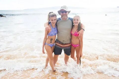 Father and Daughters Playing Together at the Beach Stock Image - Image of b...