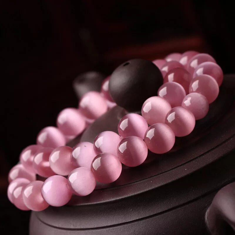 Pink stones. Розовый кошачий глаз камень. Розовые бусы. Розовый камень Бусины. Натуральные Бусины розового цвета.