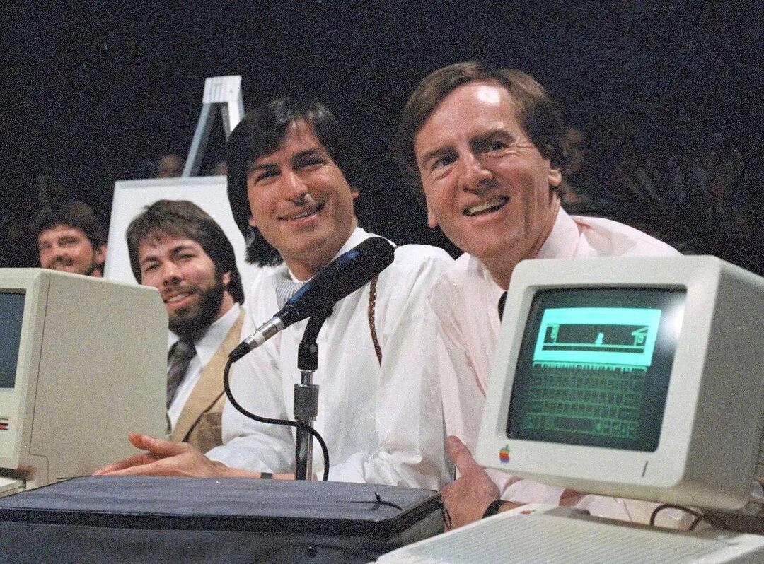 1 апреля 1976 джобс и возняк. Next презентация. Шрифт apple 1977. Неттоп интел целерон. Xcel brands, inc акции лого.