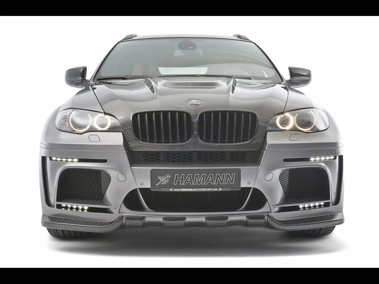 Хаман перевод. X7 bmw хаманн hamann. Обвес hamann x6. Красивая надпись хаманн. Обвес hamann tycoon evo bmw x6 e71.