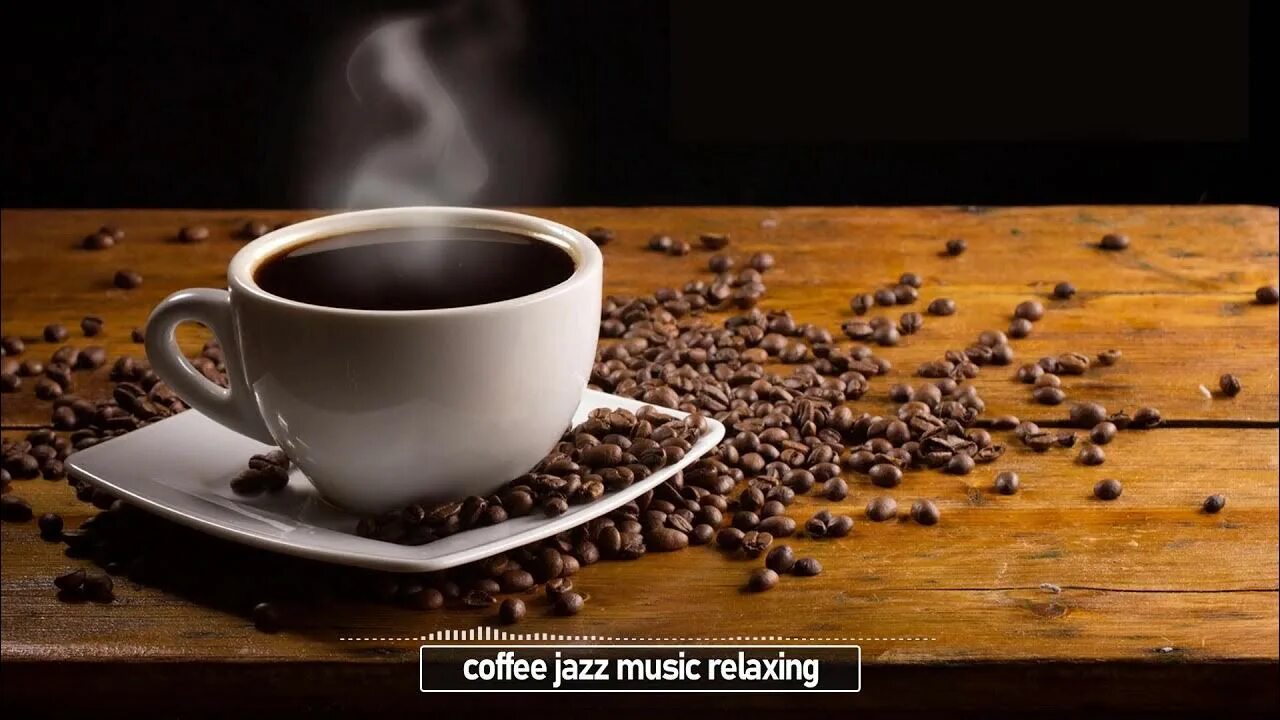 Download Hot Espresso Surrounded By Coffee Beans Wallpaper Wallpapers.com