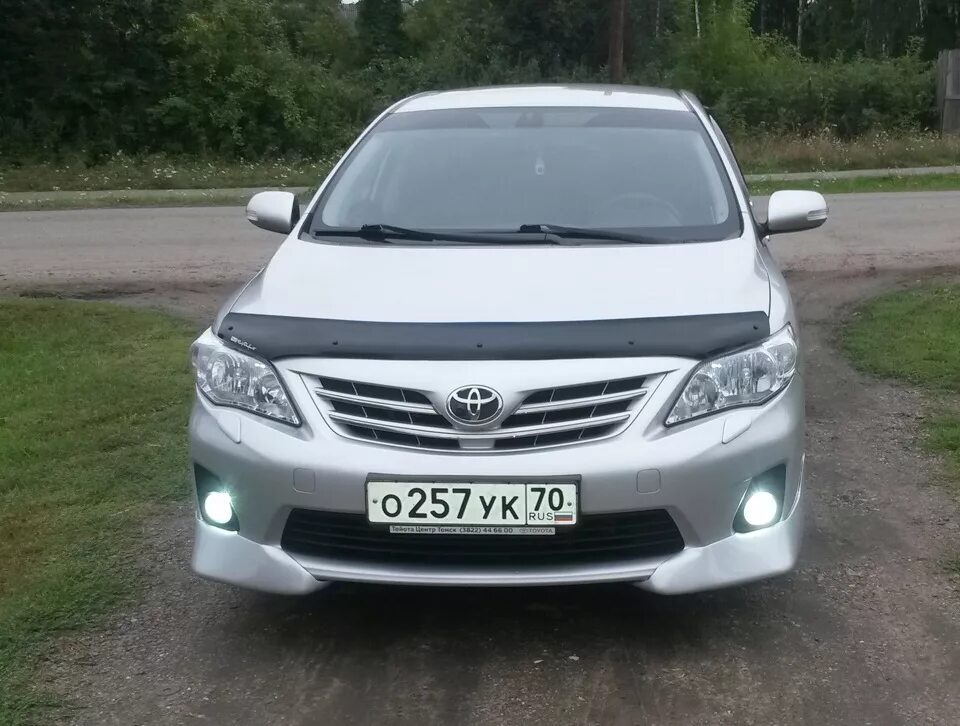 Дром королла алтайского края. Toyota Corolla 150 клыки. Toyota Corolla 2007 бампер Лексус. Королла 150 бампер Лексус. Клыки на Тойота Королла 150.