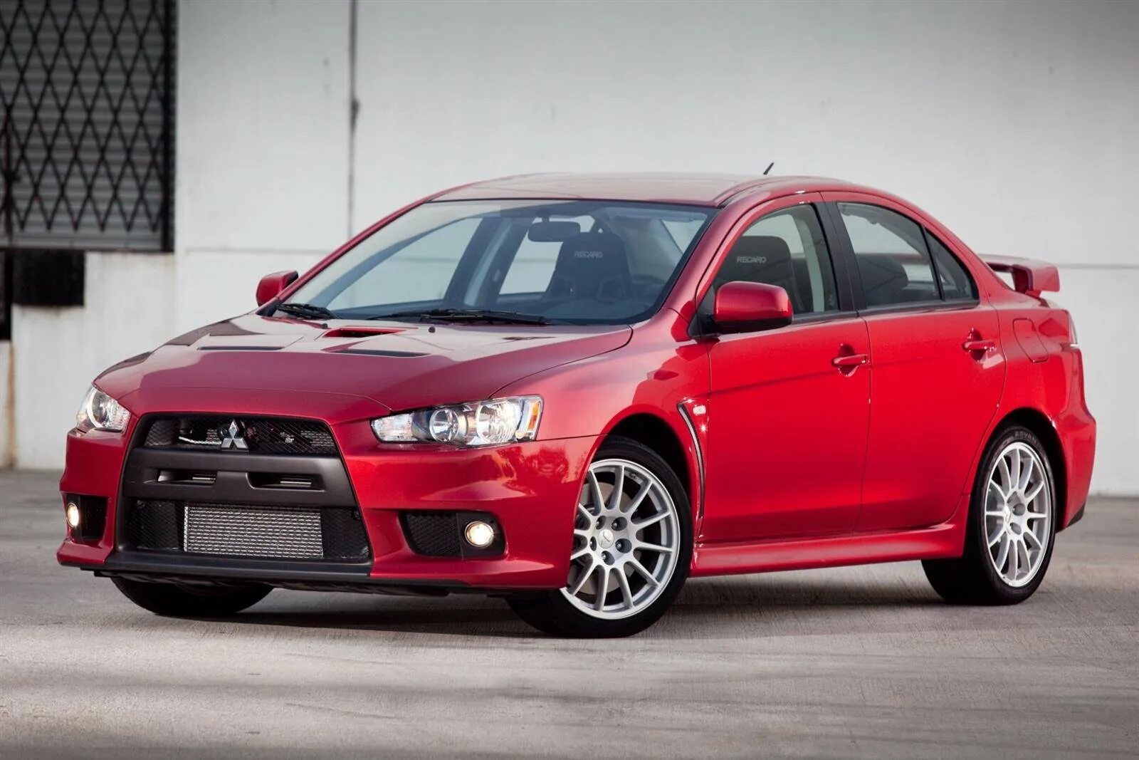 Лансер собран. Митсубиси Лансер Эволюшн 10. Мицубиси Лансер 2010. Mitsubishi Lancer Evolution x 2010. Mitsubishi Lancer Lancer 2010.