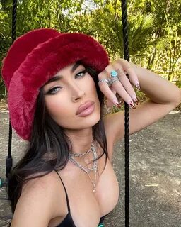 Megan Fox posted a photo on Instagram wearing a fuzzy bucket hat and a blac...