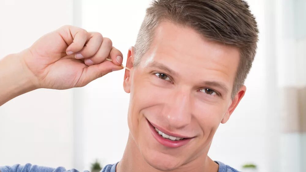 Man catch his Ears. Бусы плохо парня. The child cleans his Ears.